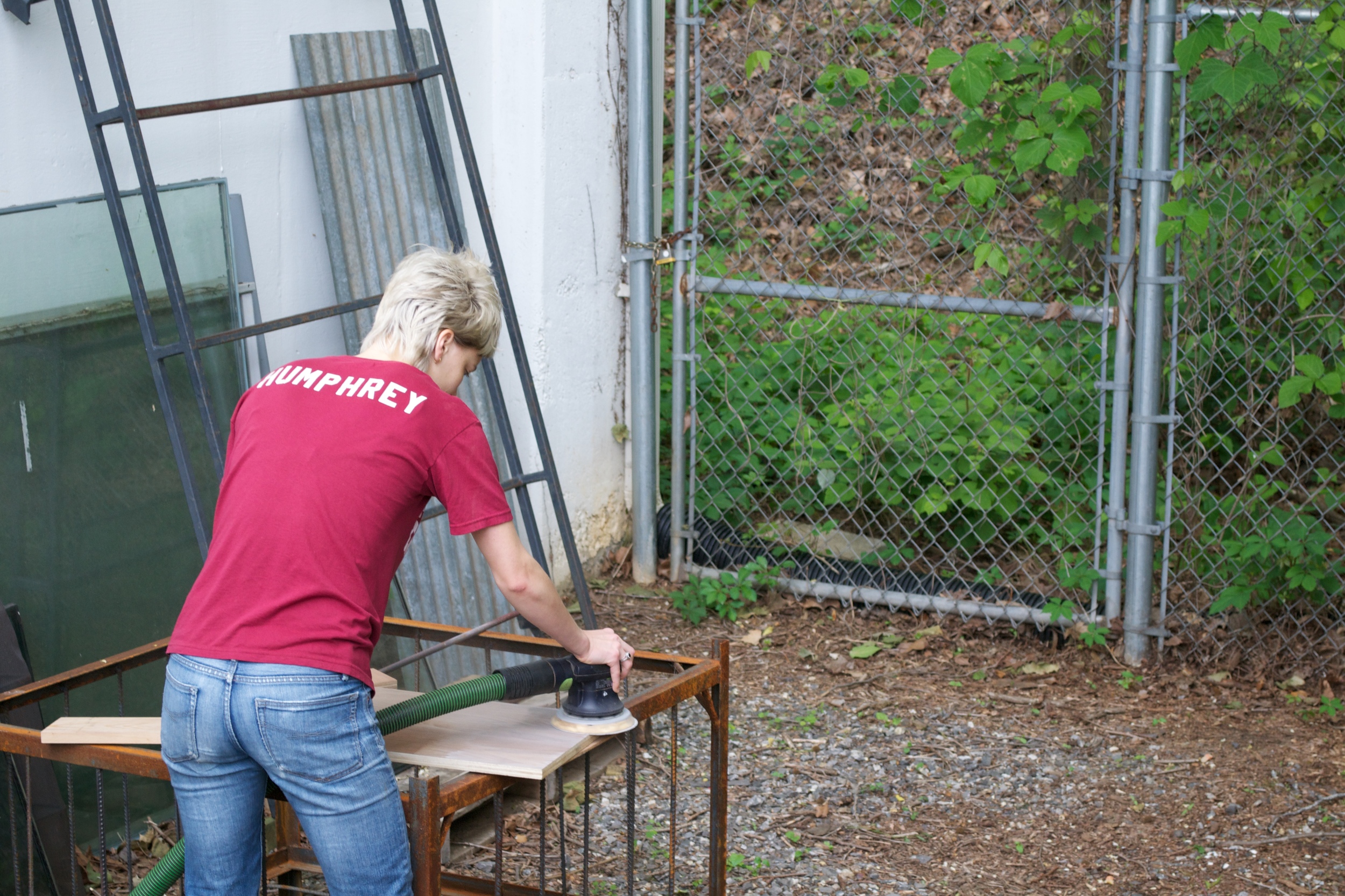 Eva working on putting together some Minwax white pickle samples on walnut veneer ply