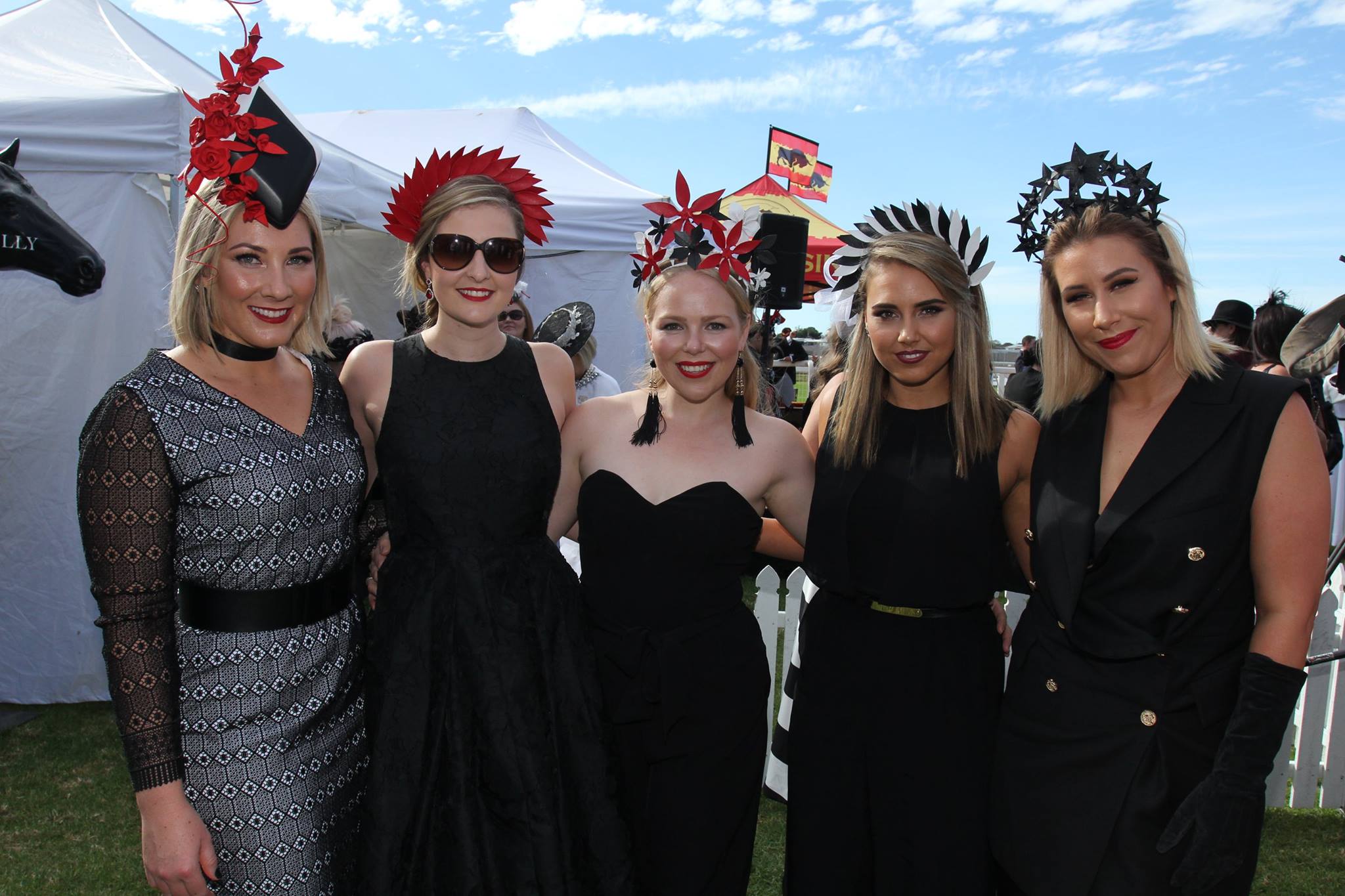 With the lady behind the millinery masterpieces, Sophie (centre) of Allport Millinery and gorgeous ladies at Indooroopilly FOTF stage. Image by Ross Stevenson
