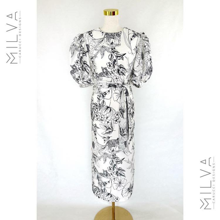 Ready to Wear 
'TORA'

Bring out your wild side in elegance, in our RTW 'Tora' dress 

The Dior inspired print is a sure standout in any crowd.
The unusual mix of floral and animal print. in off white and black colours is ideal for derby day, Stradbr