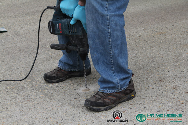 Drill holes through concrete into subgrade.