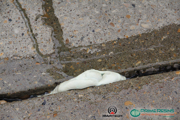 Prime Resins Precision Lift resin has been injected under the slab and it is expanding and lifting the concrete driveway slab.