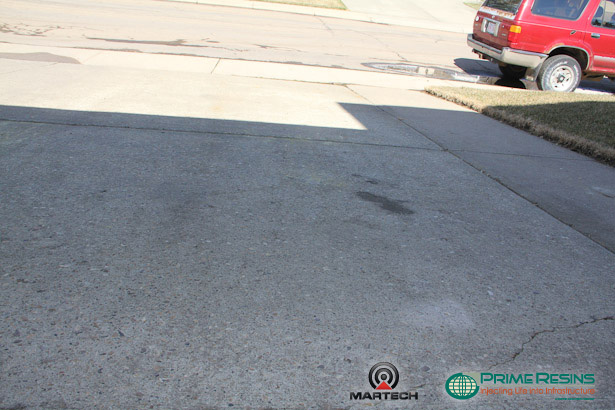 Finished job, the concrete driveway slabs were lifted back to a flush grade with Prime Resins Precision Lift foam and Equalizer Flush.