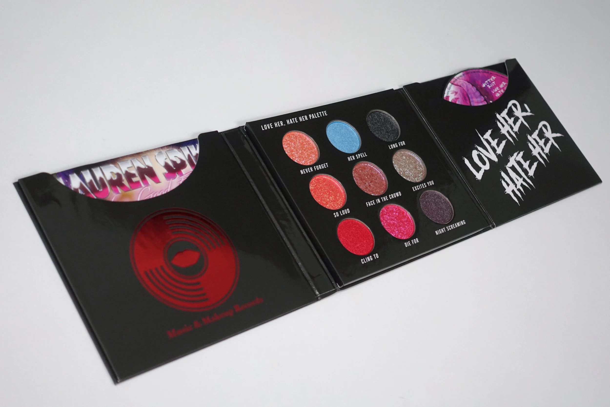 Love, Her Hate, Her Eyeshadow Palette. Eyeshadow colours  Shimmer Blush/ Peach/Mauve, Baby Blue, Glitter Black,  Gun Metal, Metallic Red/Magenta/Dark Purple.