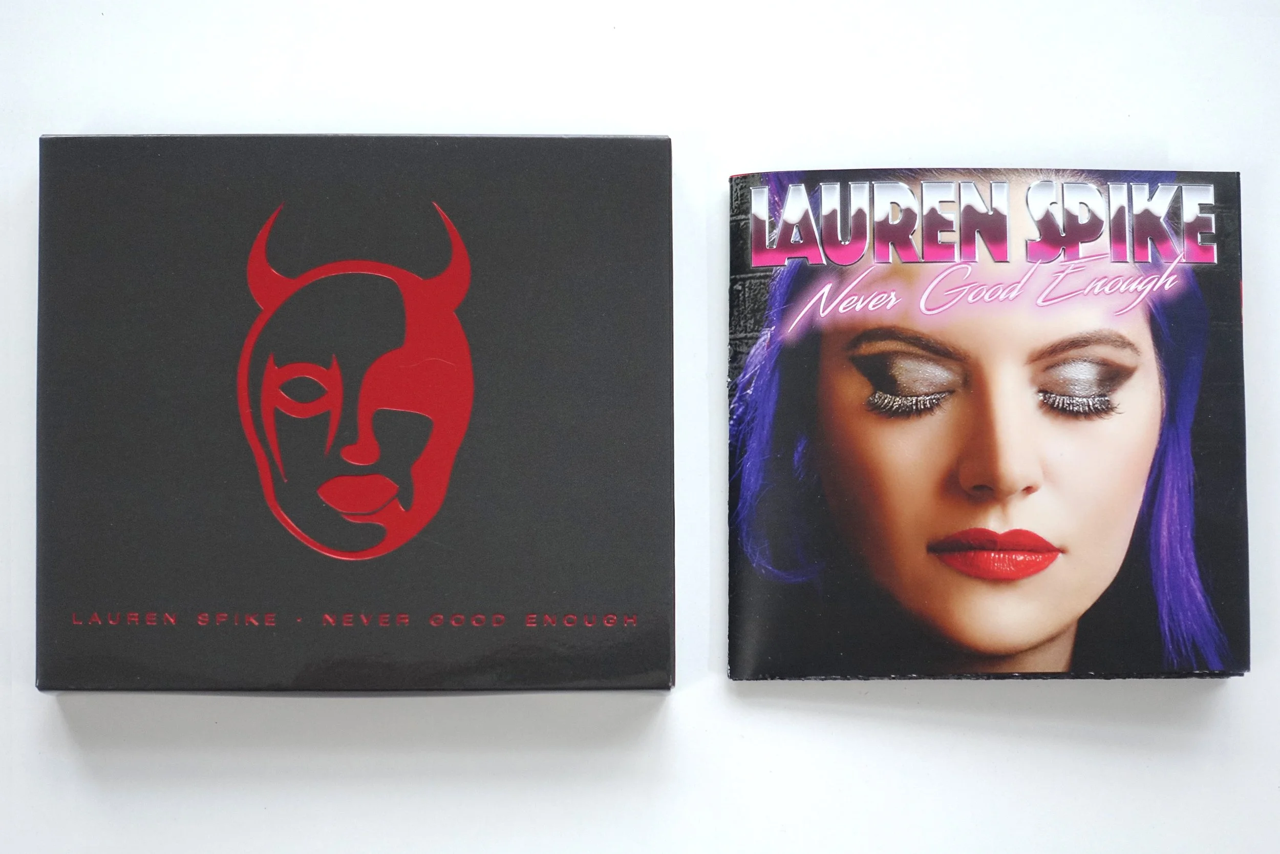 Never Good Enough CD with Metallic Red Devil Girl Logo cover
