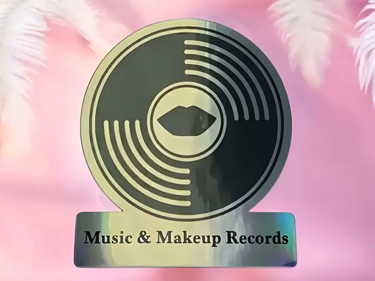 Holographic Sticker of Music & Makeup Records logo. Approx. 3.5" x 4".