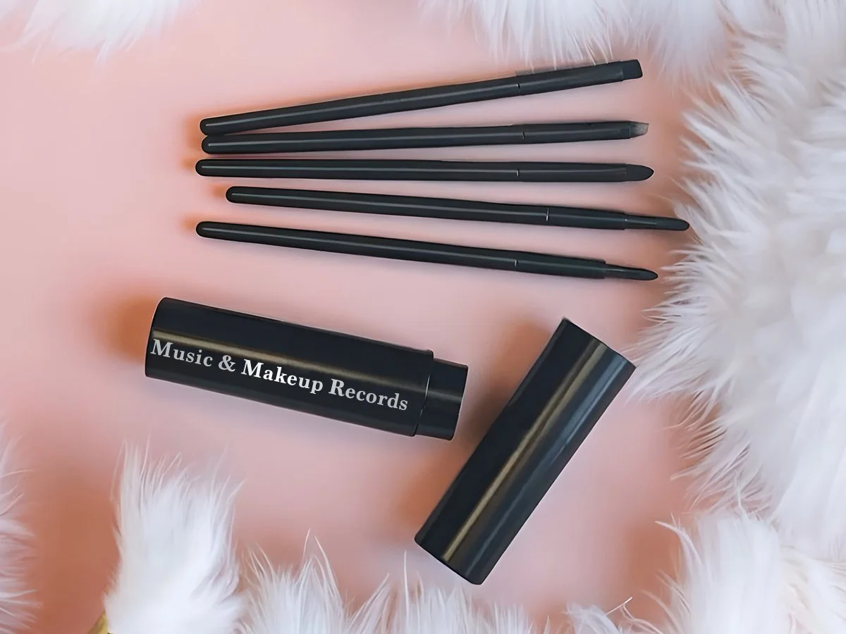 5 Mini Eyeshadow Brushes in Portable Aluminum Tube. Music and Makeup Records is written on the side of tube.