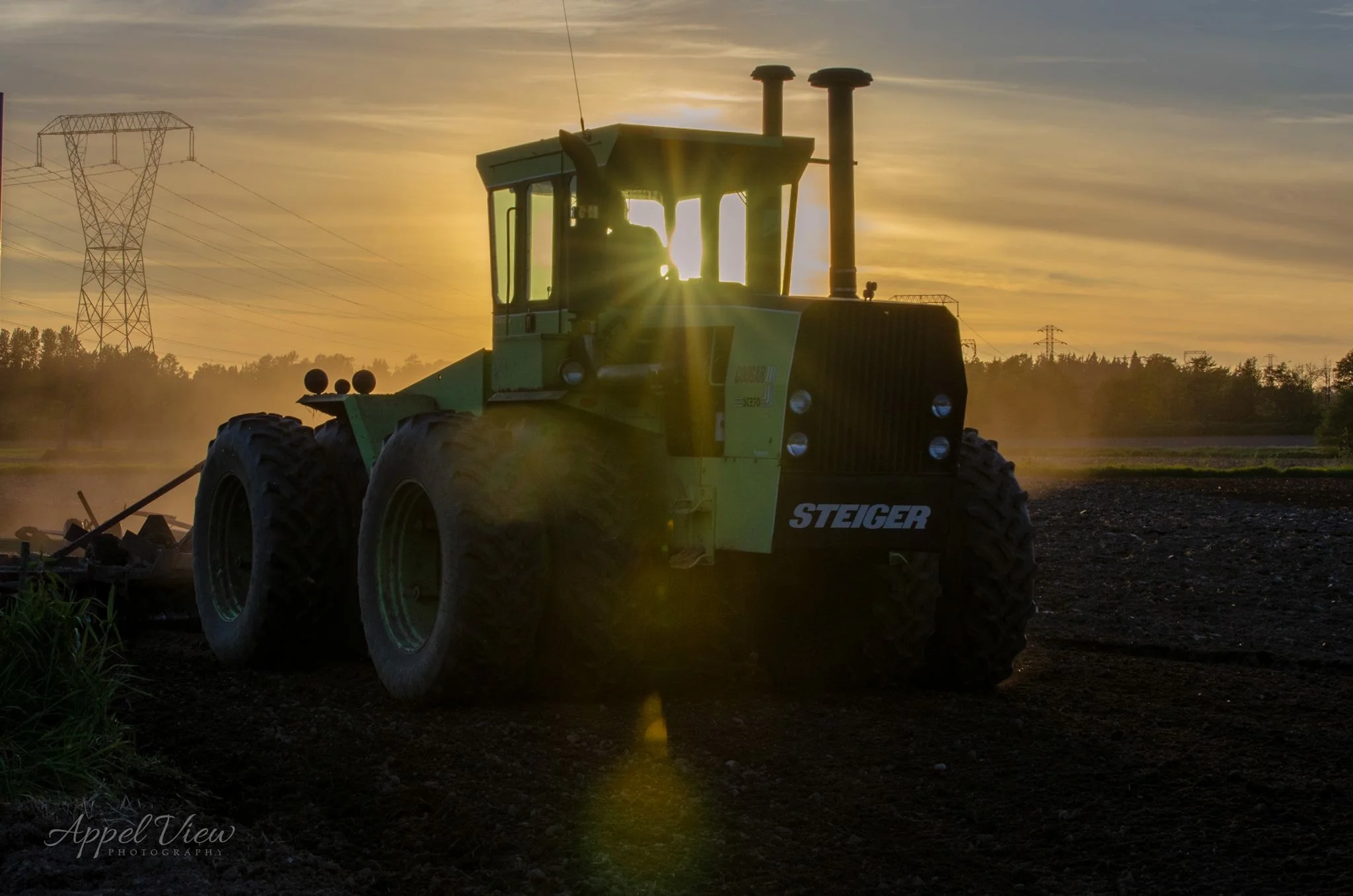 Yep! That's Chris in his tractor. (His mom took this beautiful picture!)