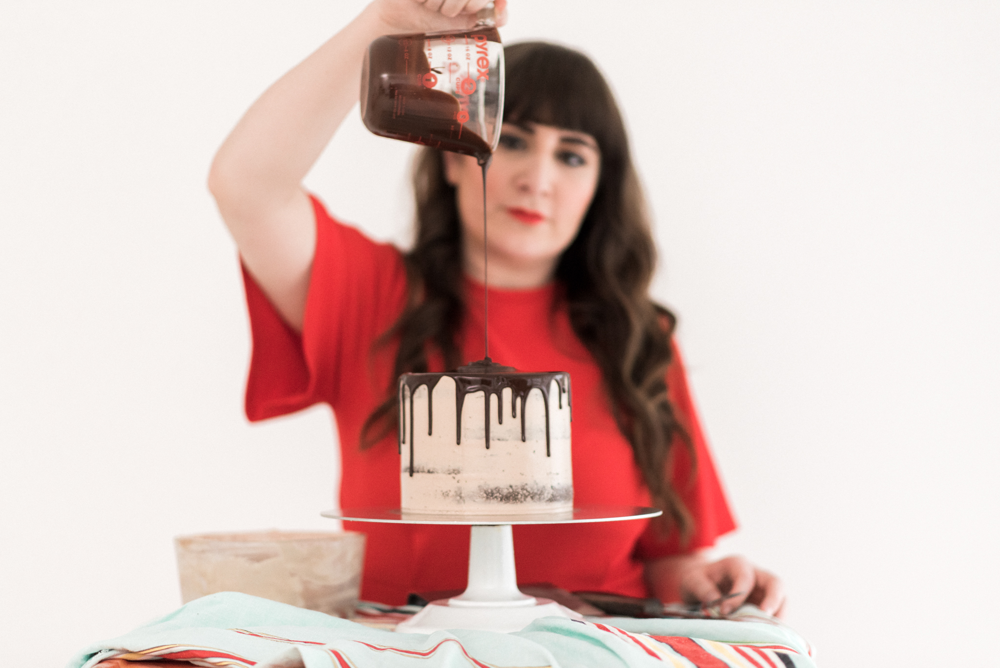 Bellingham cake maker, Saltadena, pours the perfect chocolate drips. 