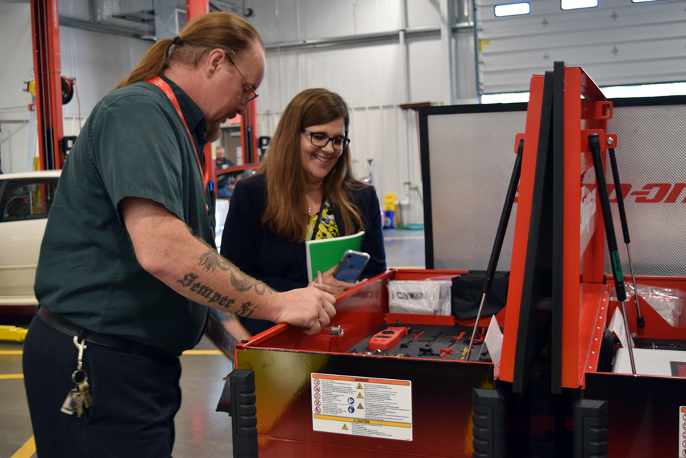 CTE Auto Tech Instructor Don Maurer shows off some new Snap-On equipment to Jennifer Geno, Saginaw’s CTE Director.