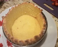 You need an adjustable rond cake ring, (on amazon.com)