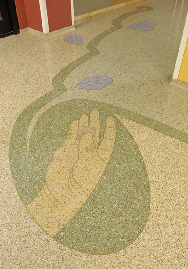 As you enter the suite, a terrazzo floor is covered with colors and images relating to exterior tiles.