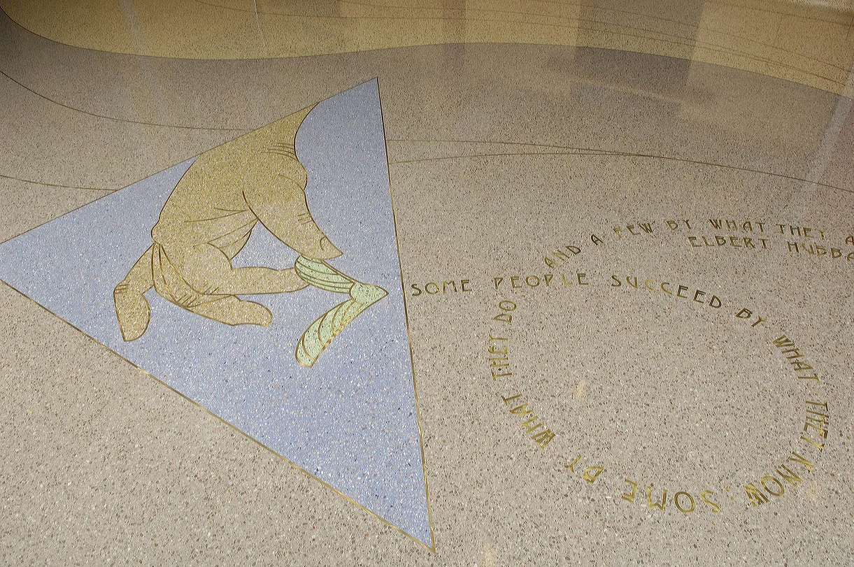 As you enter the suite the terrazzo floor is covered with colors and images relating to exterior tiles.