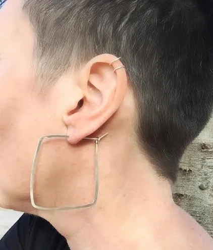 Wearing sterling silver hand-hammered square earrings