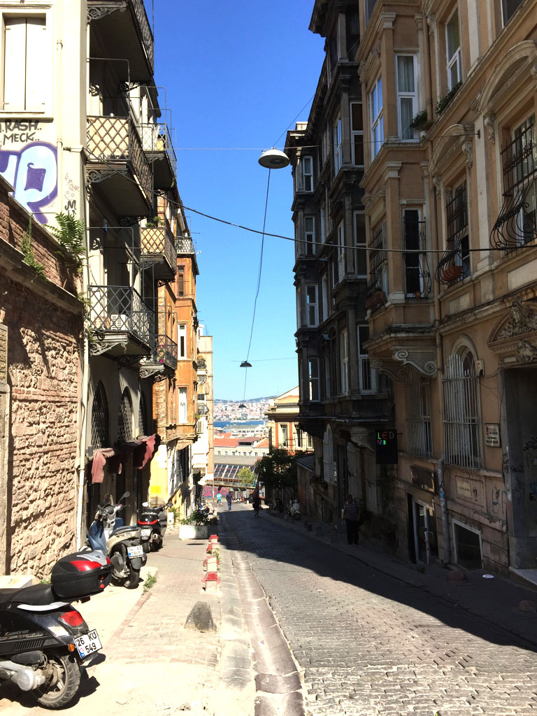 The streets of Istanbul's Beyoglu neighborhood are filled with charming cobblestone alleys with river views. Photo by Libby Ryan.