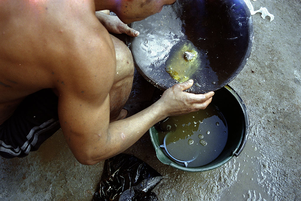   Miner uses mercury to separate gold in Segovia, Antioquia.  