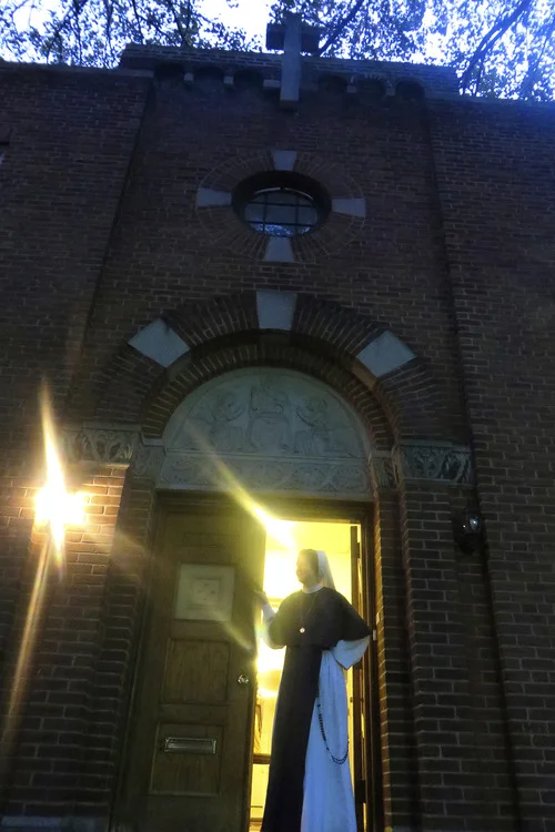 Sister Catherine, stands in the door way of the Sisters Of Life Convent in Hell’s Kitchen.