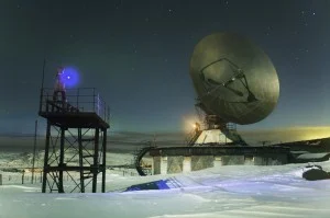 Tanya, her sister Olga, and I at the abandoned TV antenna just a little outside of the town. This is a very cold and quiet night, so quiet that our crunchy steps on the snow feel like an intervention. We try to keep our voices low, as though we are …