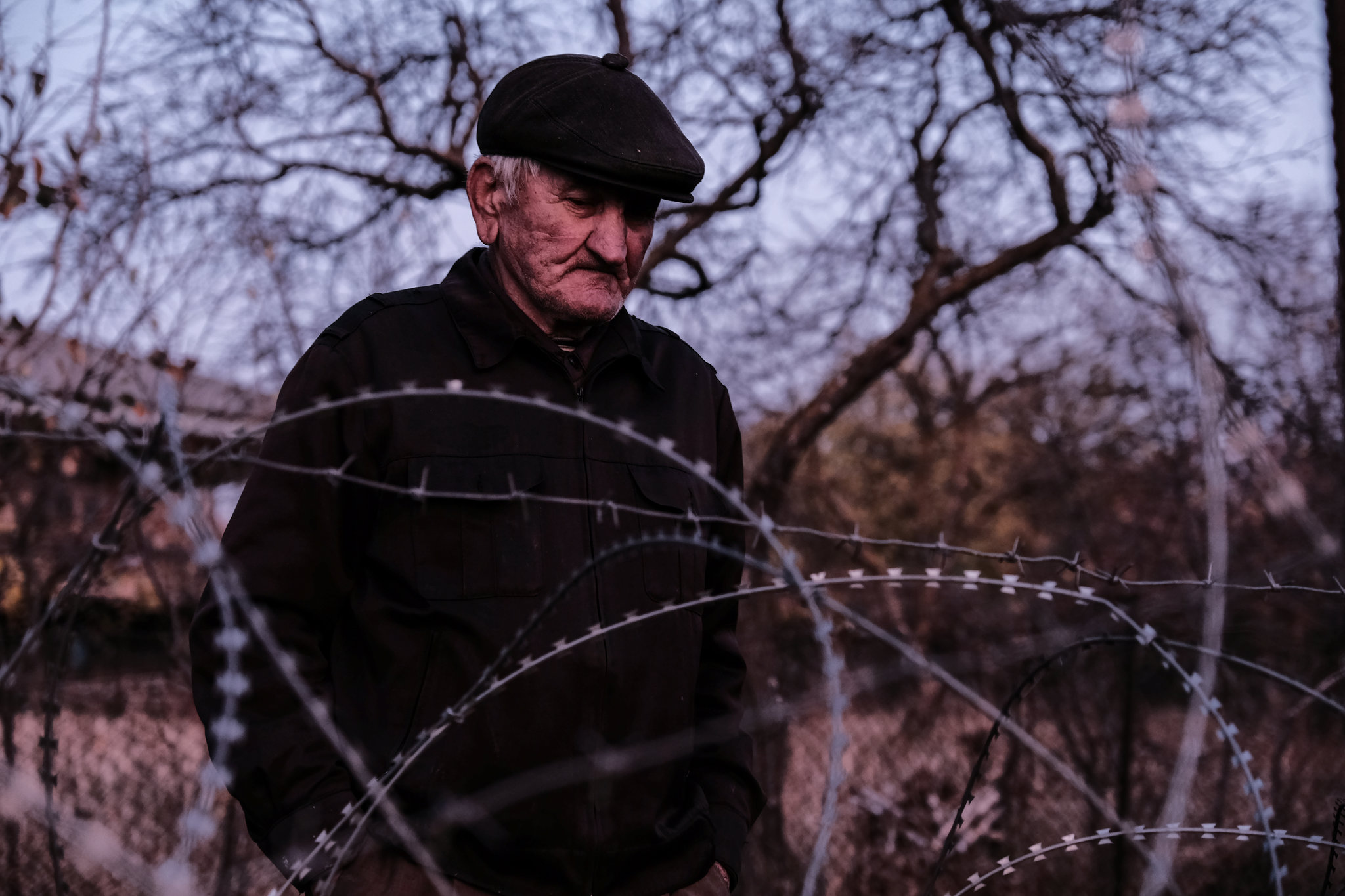  One day, Data Vanishvili found his house on occupied territory, where he lives now in poverty. He is not allowed to cross the fence and has no access to his pension. Village of Bobnevi, 2017. 