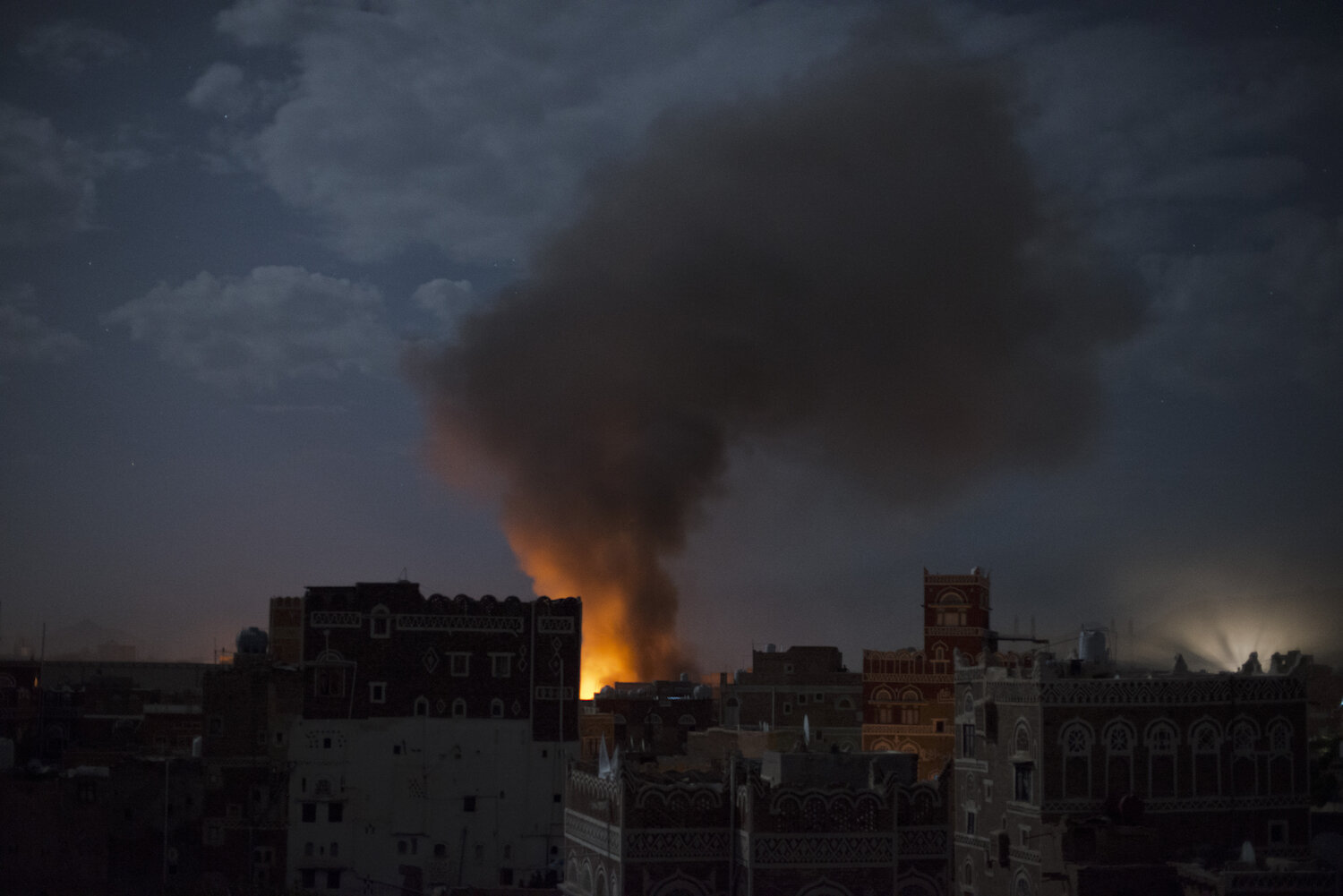  Smoke from an airstrike on al Orthy Hospital rises from the Ministry of Defense complex in Sana'a, Yemen on June 9, 2015. 