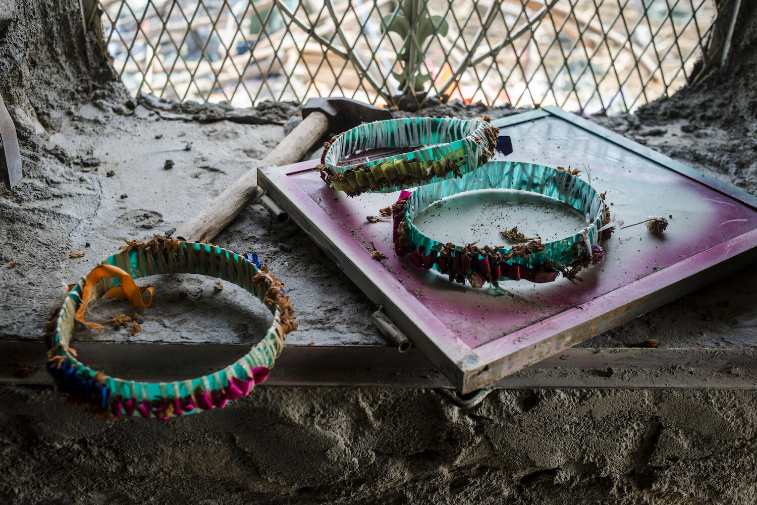  Wreaths worn by those celebrating at the wedding sit amid the rubble on May 6, 2018 in al Ragha Village, Bani Qais District, Hajjah, Yemen. The villagers had been celebrating late into the night when the airstrike hit; most of the dead were in piece