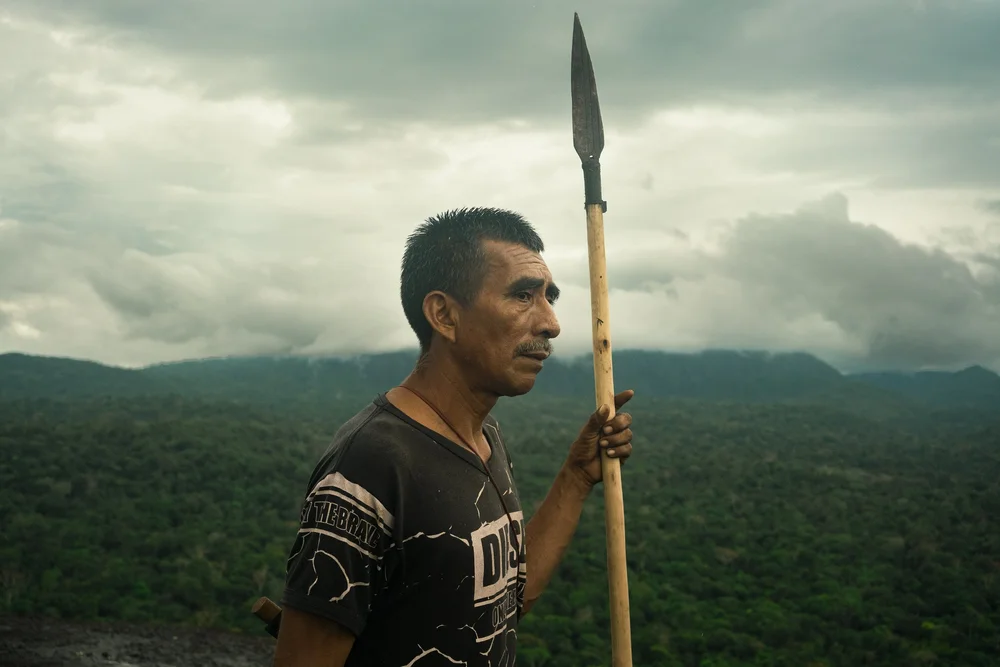  Jose Ponare, 64, puts the finishing touches on the new communal home of the Huöttöja people in the Amazonas state, Venezuela. He is one of the few elders of the community. 