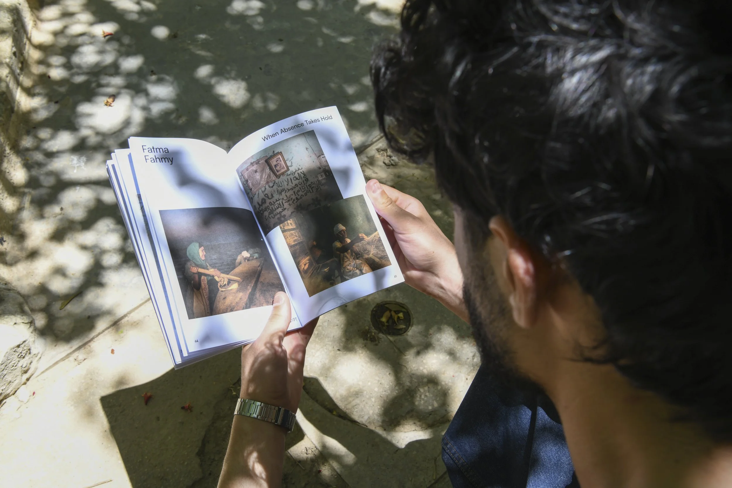  Festival visitors reading the zines. Photo by Nadia Bseiso. 