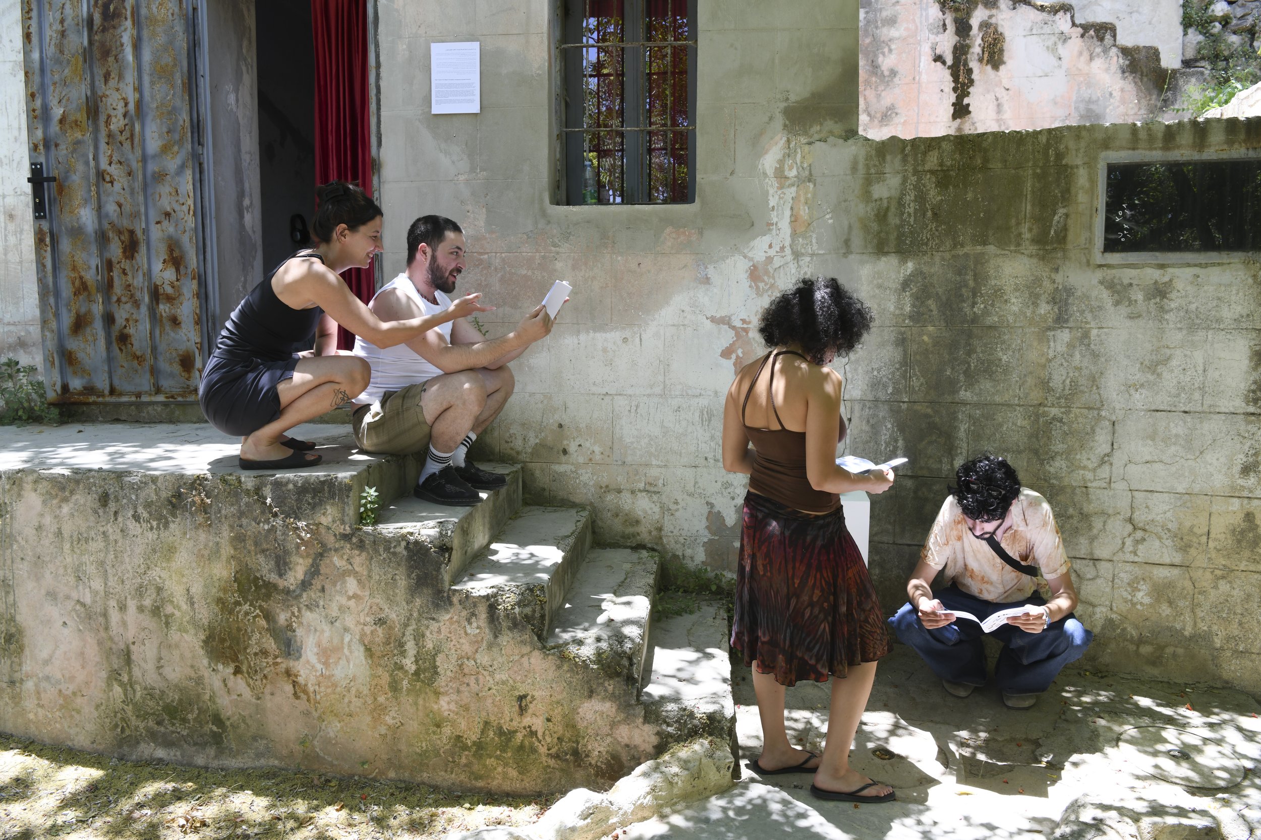  Festival visitors reading the zines. Photo by Nadia Bseiso. 