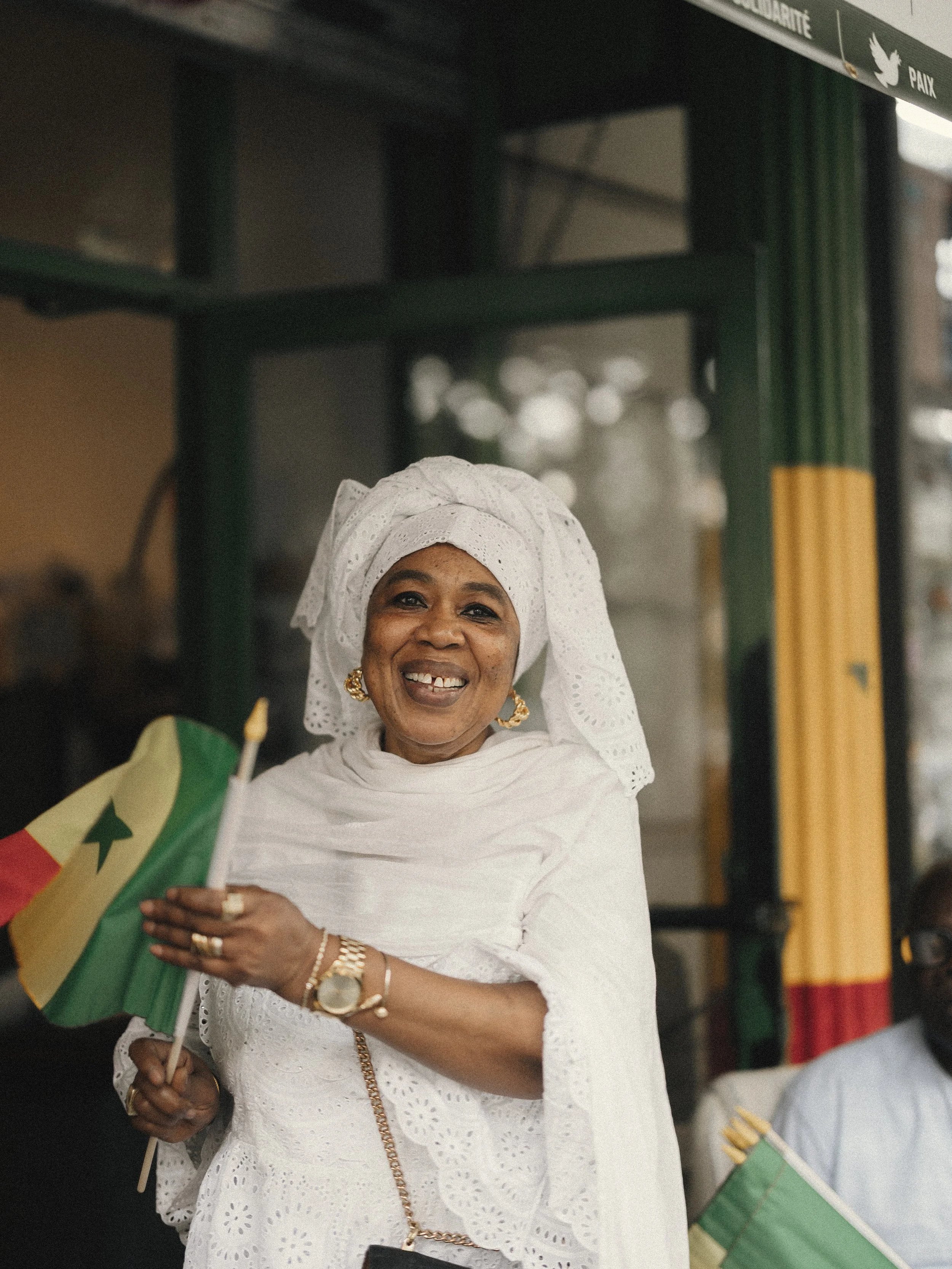  A Senegalese supporter holds the national flag after Senegal’s victory over Iraq during a World Cup gathering in Harlem, New York City, June 26, 2026. 