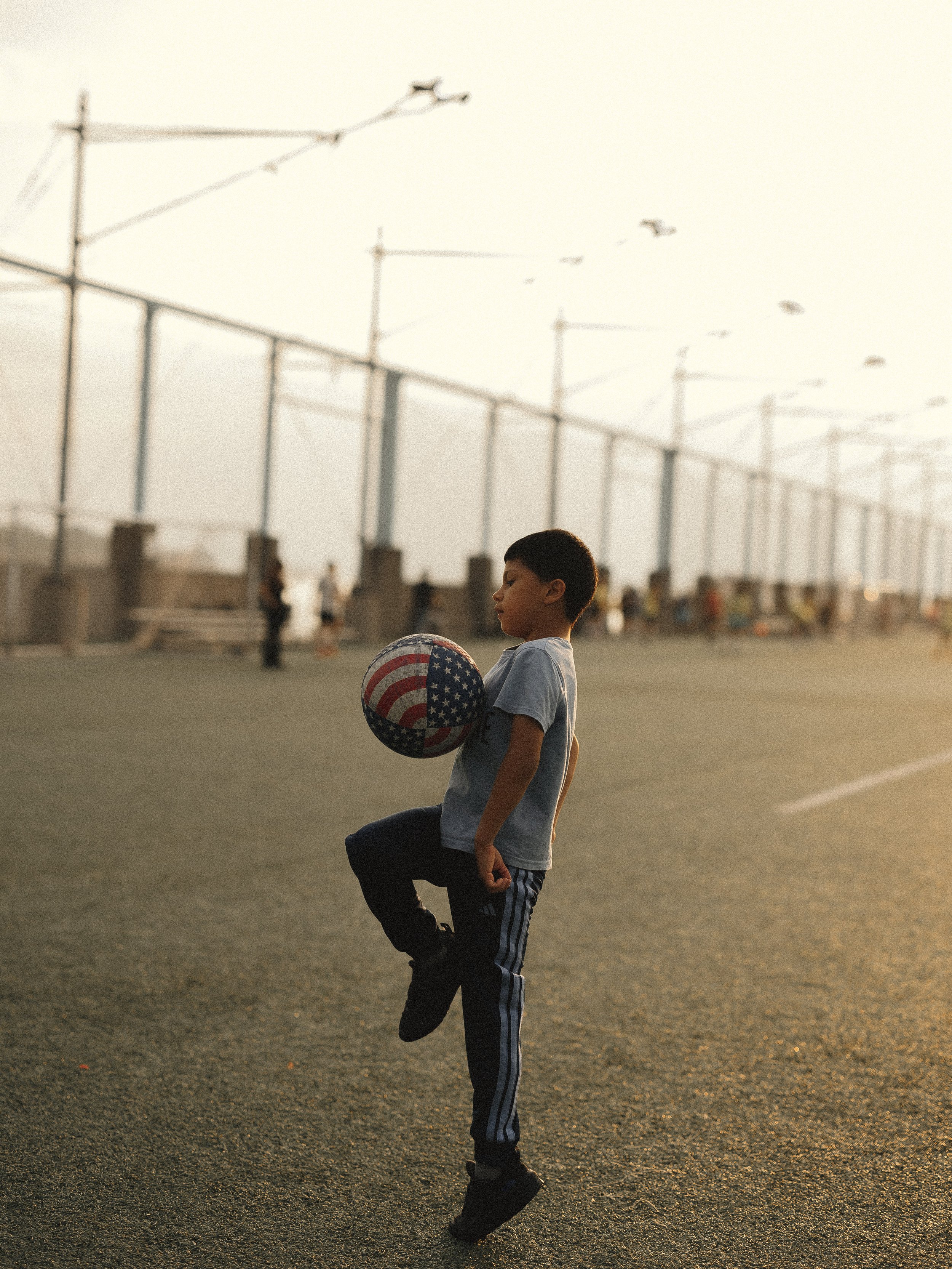  A portrait of Aron, the son of Edward Scissorkicks player William, during a match with the Ecuadorian football league team at Brooklyn Bridge Park, New York City, June 27, 2026. 