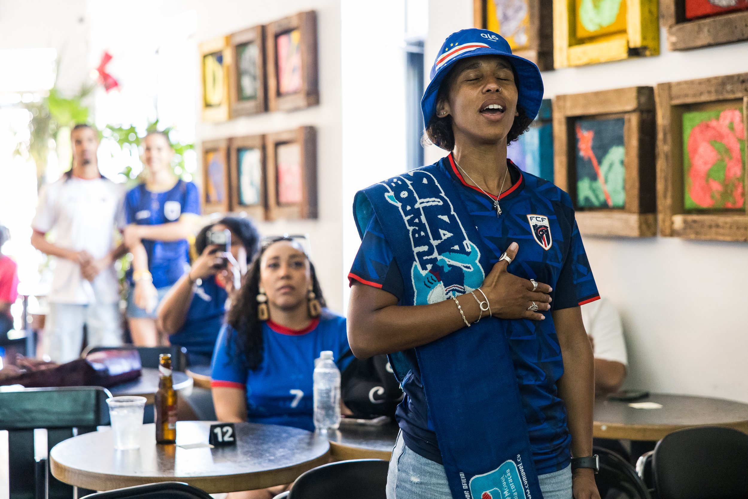  Lelo Roche sings the Cabo Verde National Anthem ahead of their first game against Spain. Bed-Stuy, Brooklyn, June 15, 2026. 