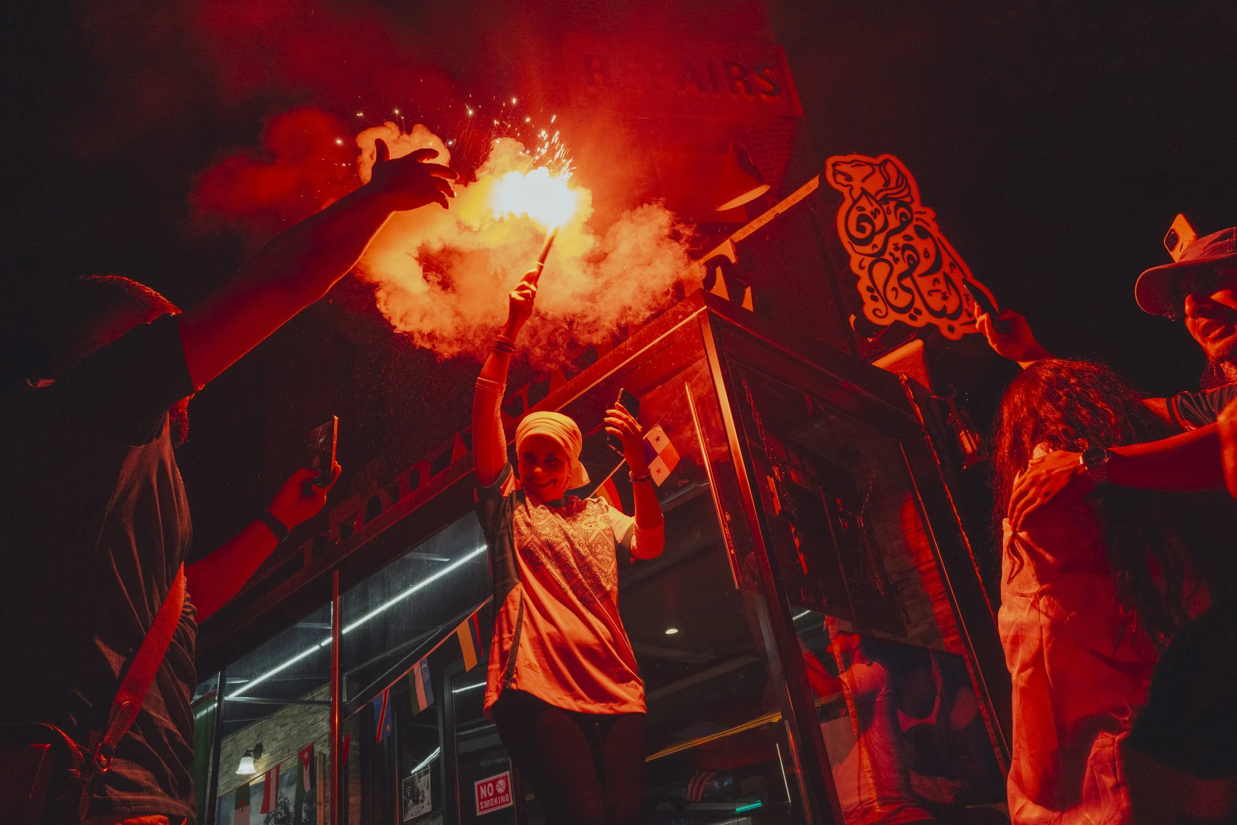  Algerian fans celebrate after the Austria-Algeria match outside L'Oranaise in Bay Ridge, Brooklyn, on June 27, 2026. 