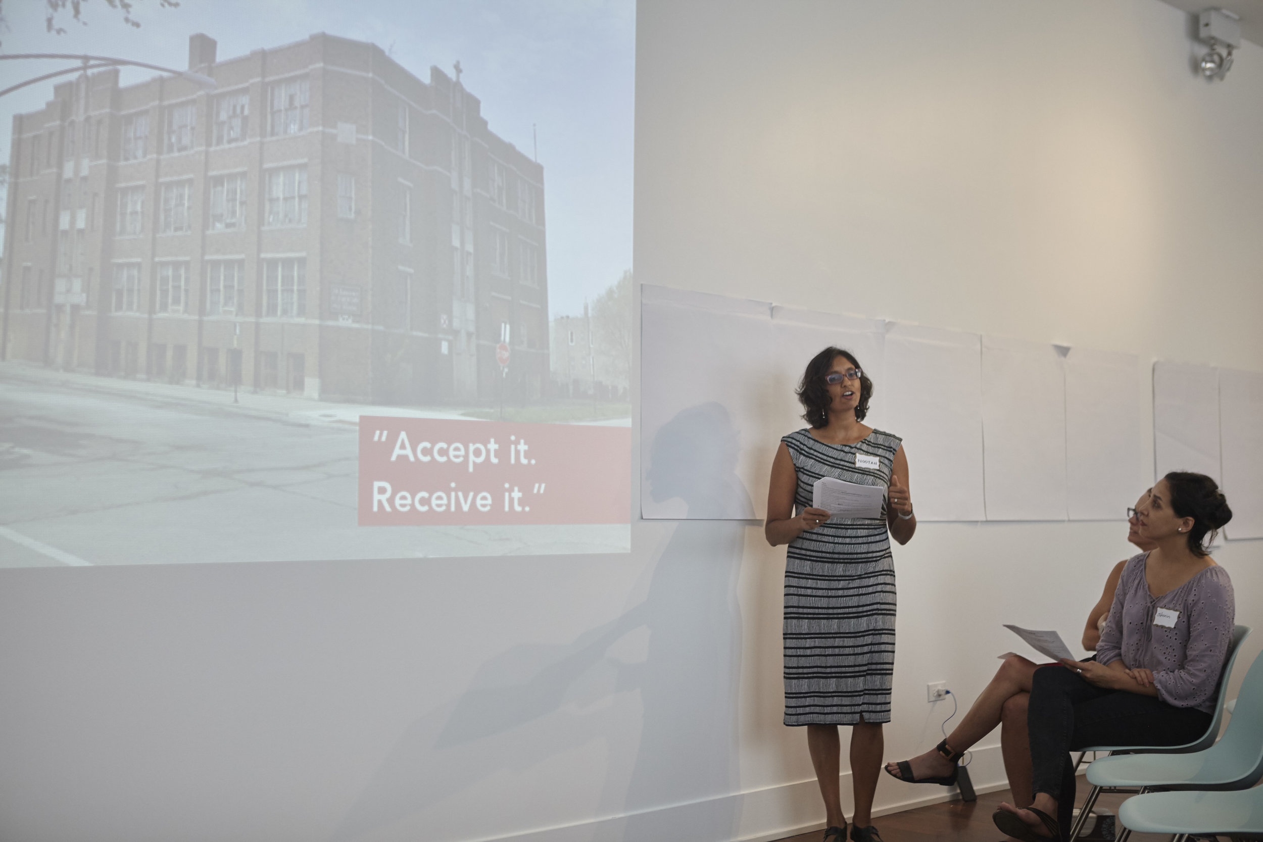 Nootan Bharani presenting on the St. Laurence Elementary School project.