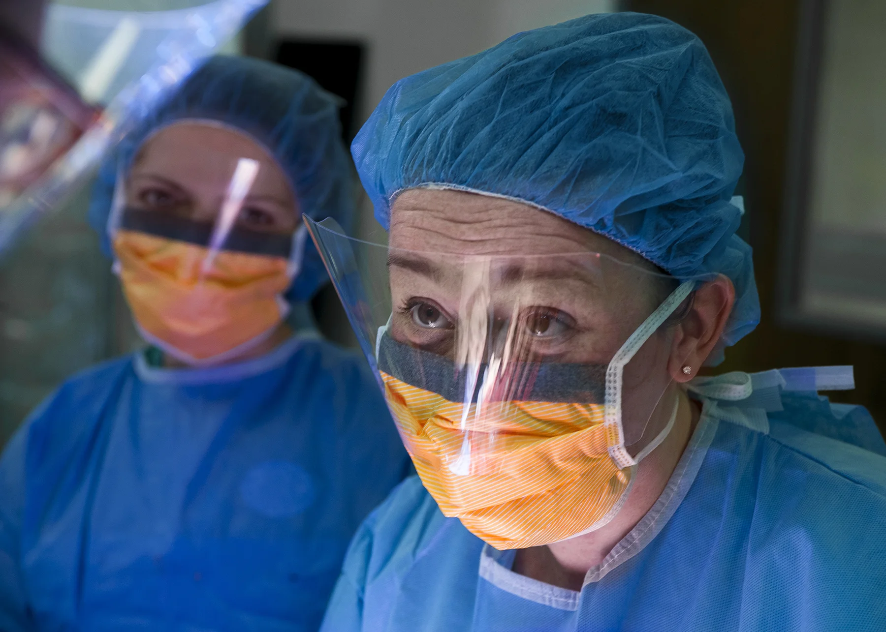  Dr. Burnette takes a look at the attending physician, Dr. Broecker, with medical student Maria Rodionova listening in the background. 