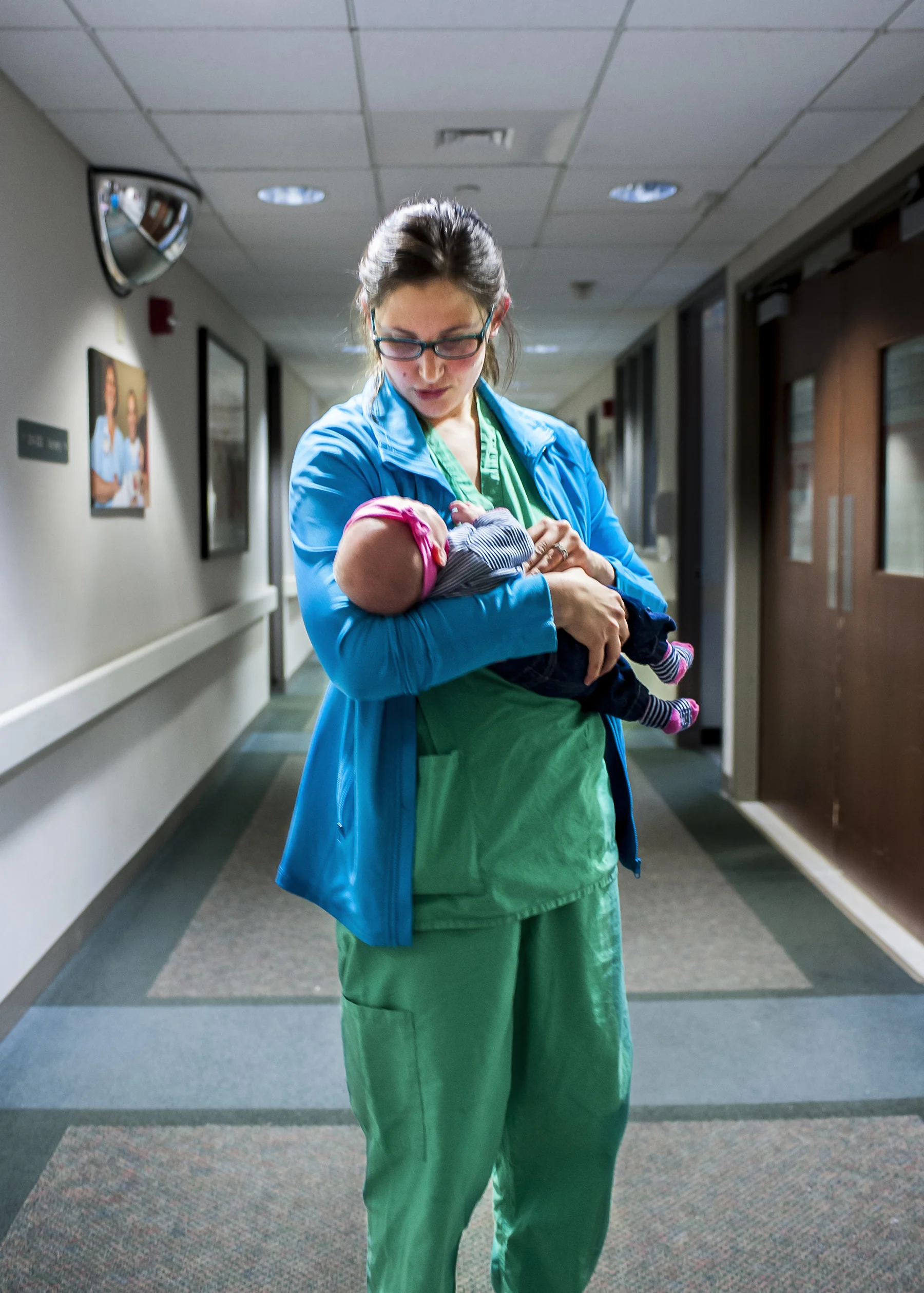  Dr. Gerlach comforts 6 week old baby girl Kameron Colwell while on break. Kameron is the daughter of one of the attending nurses that evening. 