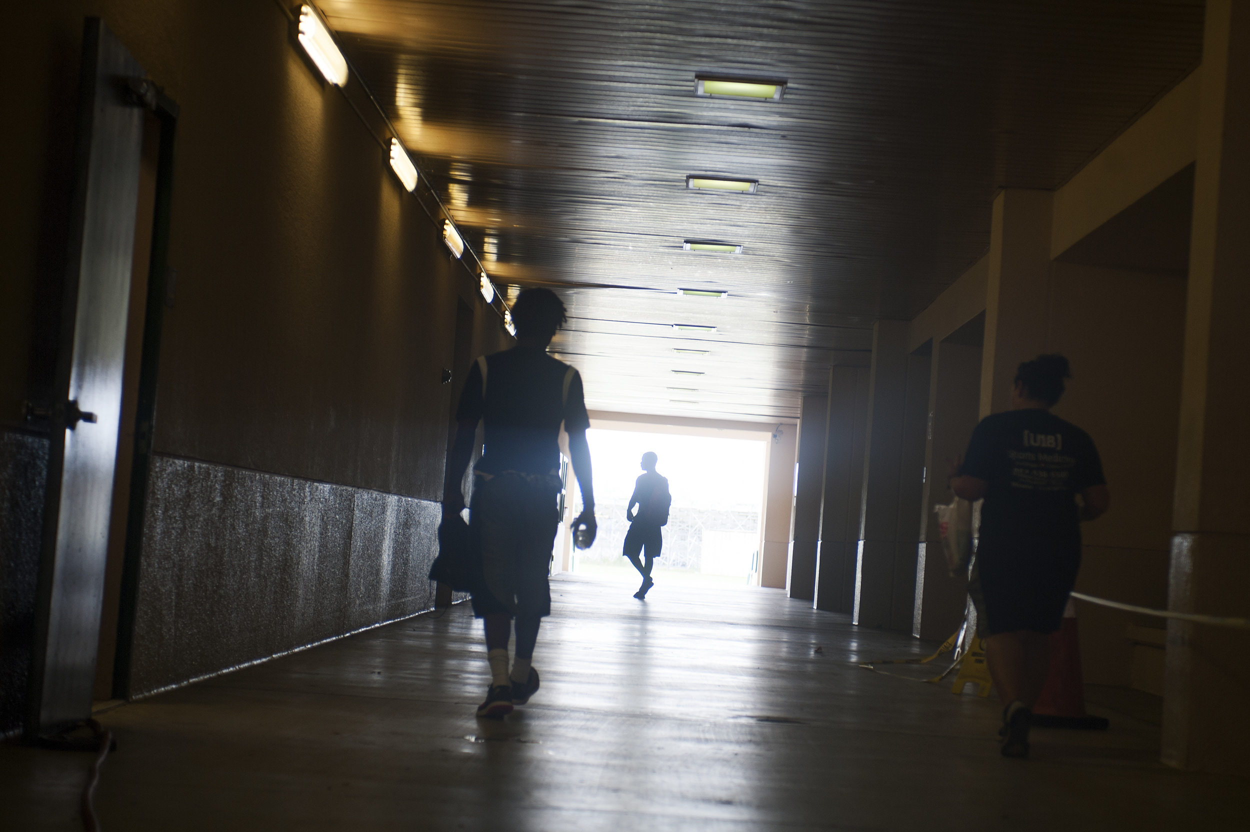 Flanagan high school football players make their way to the locker room prior to the start of the first practice of the high school season at Flanagan High School on Monday, Aug. 1, 2016. The reigning state champions look to repeat again despite the loss of key players from last year.