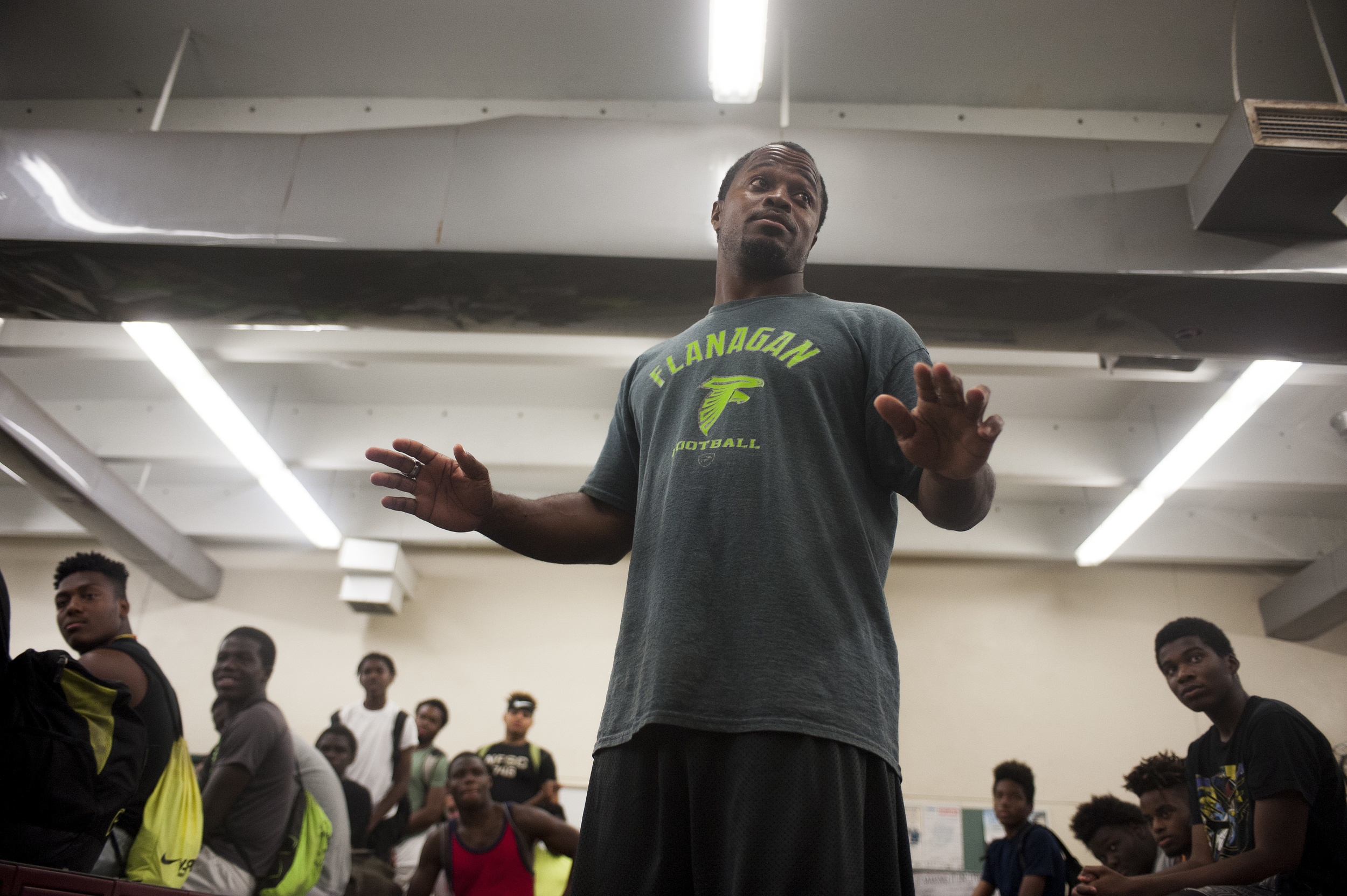  Flanagan high school head coach Stanford Samuel II talks to his team int he locker room during the first practice of the high school football season at Flanagan High School on Monday, Aug. 1, 2016. The reigning state champions look to repeat again d