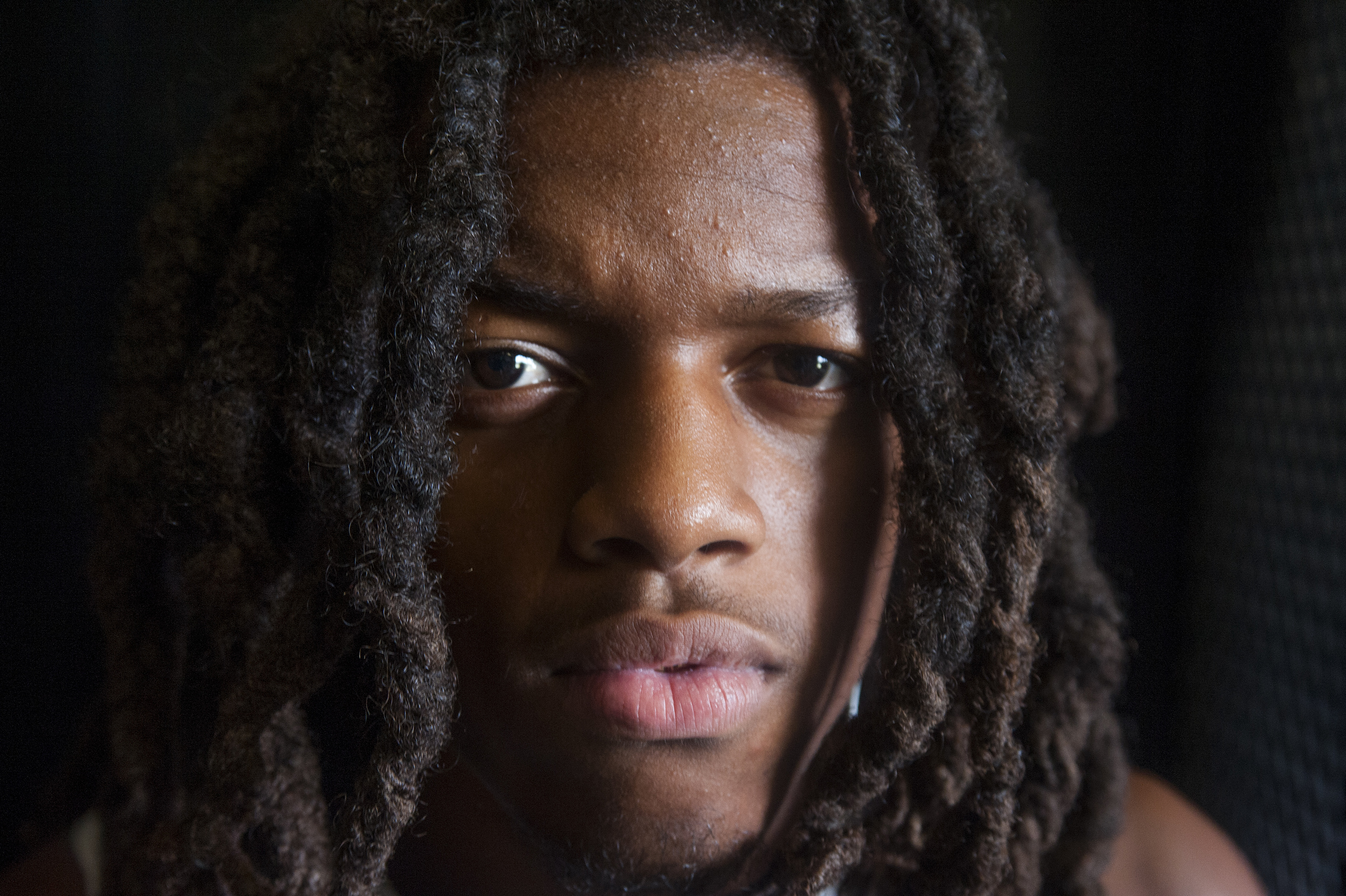  Flanagan high school senior wide receiver Caleb Thomas poses for a portrait while getting dressed for the first practice of the high school football season at Flanagan High School on Monday, Aug. 1, 2016. The reigning state champions look to repeat 