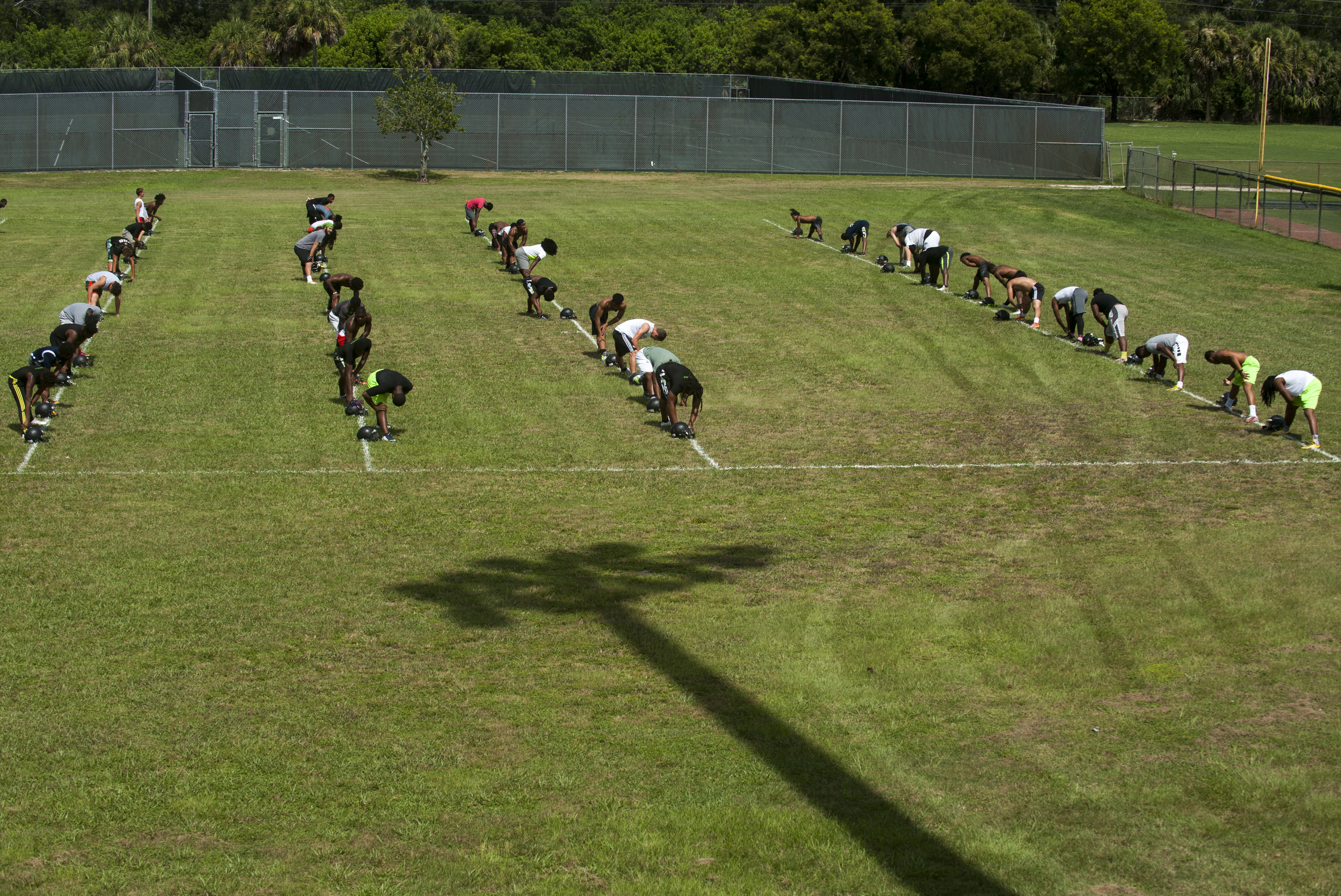  The Flanagan High School football team line up for stretches during the first practice of the high school football season at Flanagan High School on Monday, Aug. 1, 2016. The reigning state champions look to repeat again despite the loss of key play