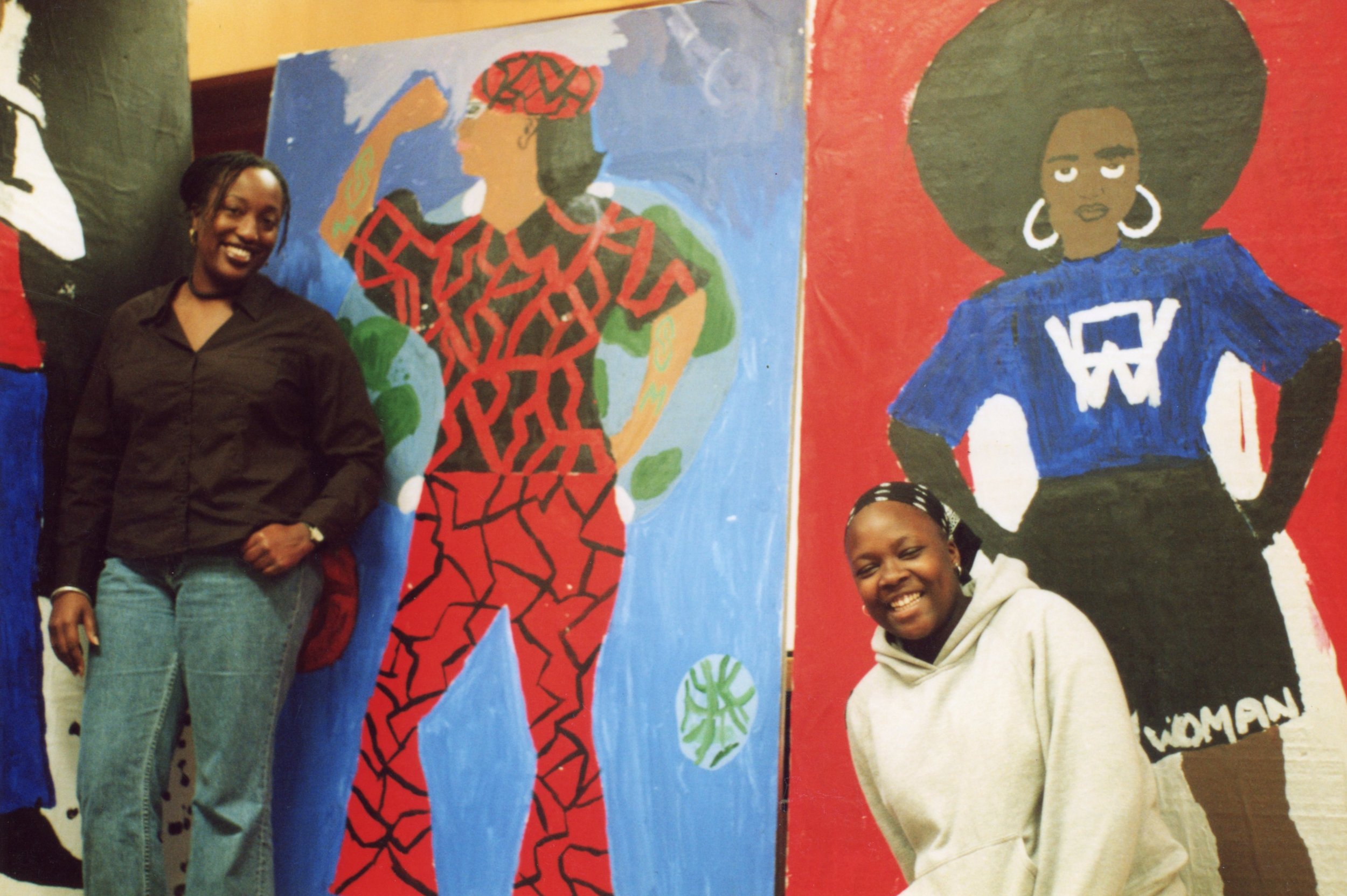  Amana and an ArtEsteem student in front of completed Self As Super Hero life sizes.  