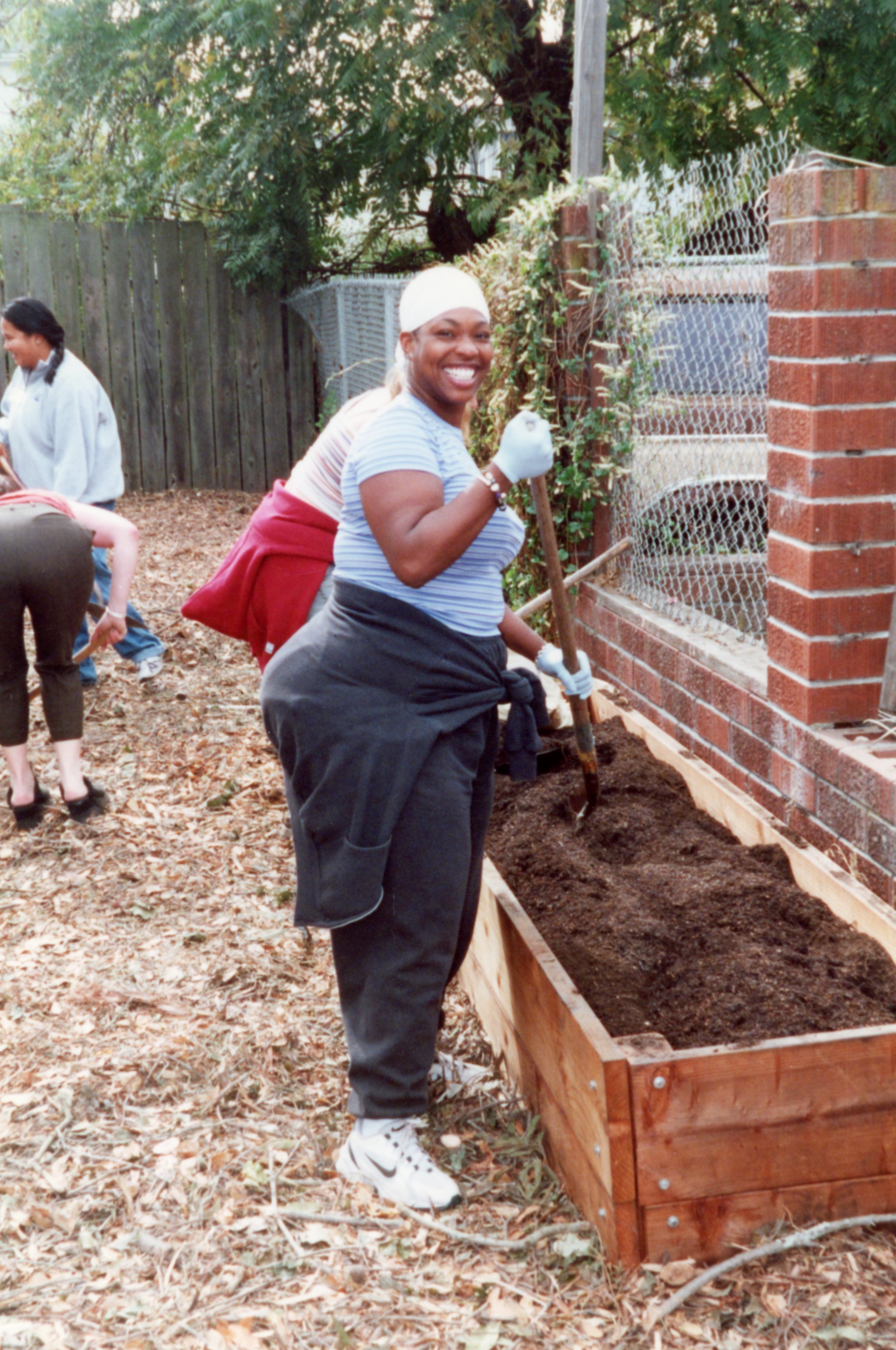  ArtEsteem volunteer cultivating the garden at 3278 West Street.  