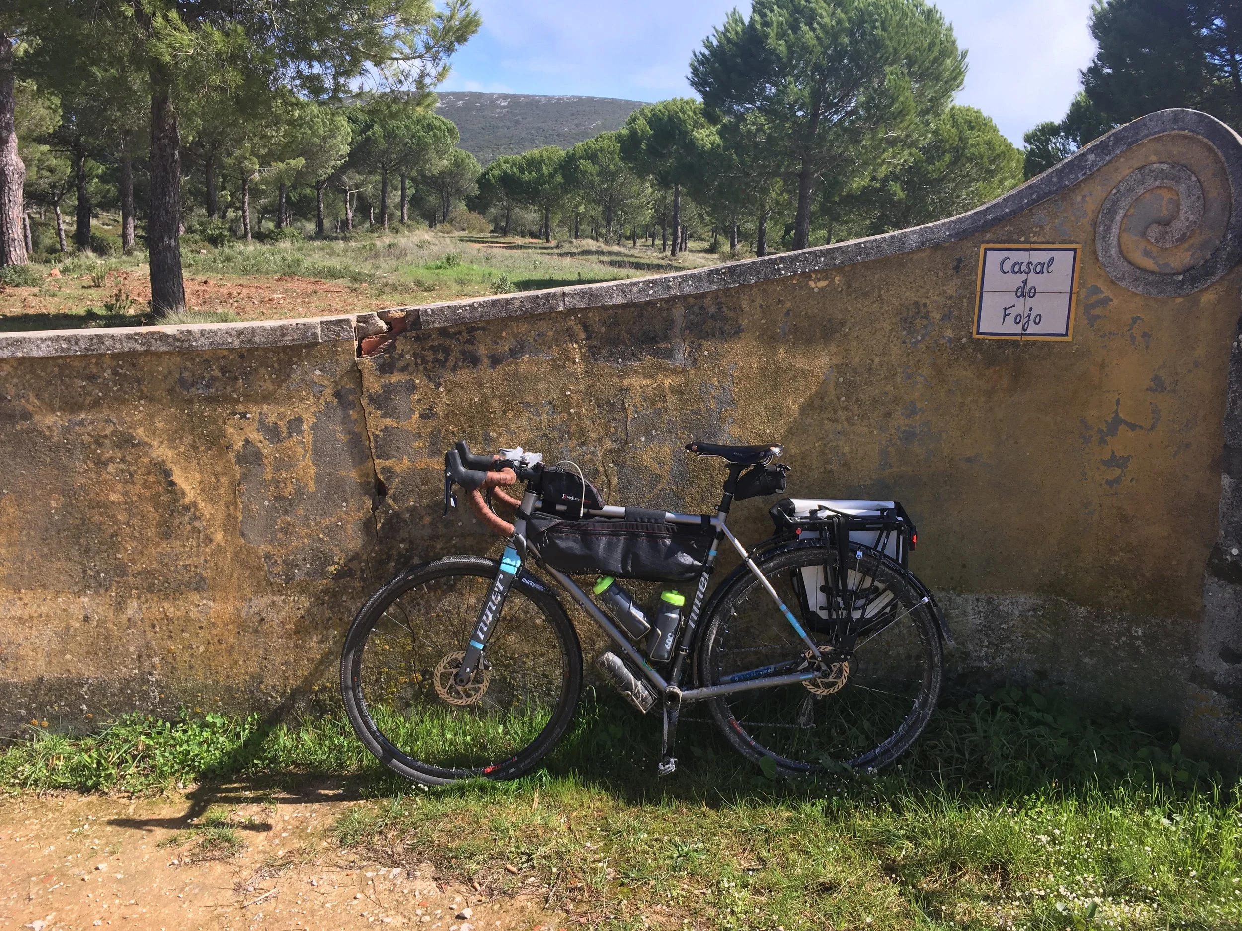 wall and bike on gravel road.jpg