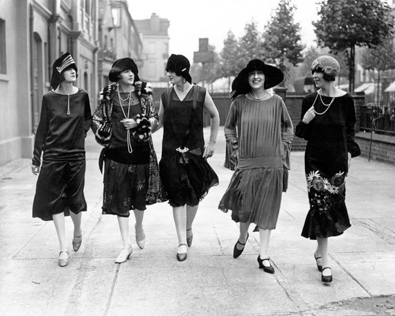 A group of friends out for a stroll in 1920s Paris.