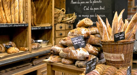 A boulangerie with its delectable array of fresh breads, warm from the oven.