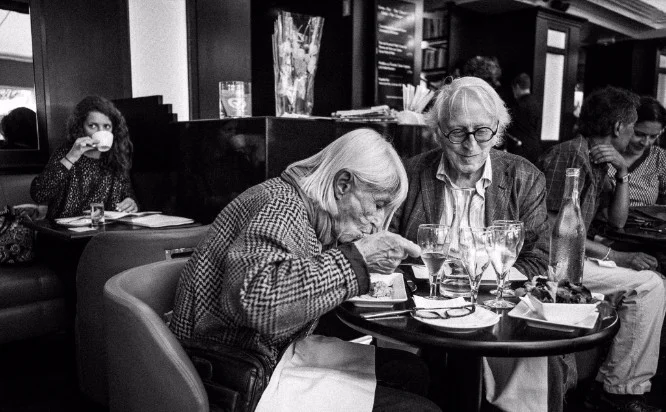 A couple enjoying lunch at the café Les Editeurs in Paris.