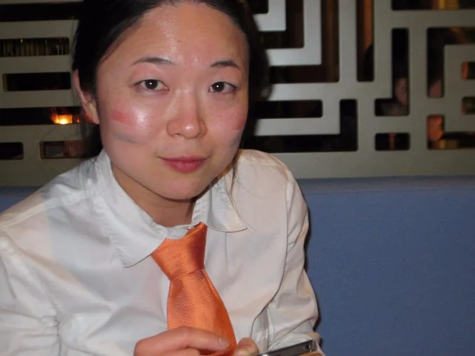 After a long day of reveling...note the Dutch flag painted on her face.