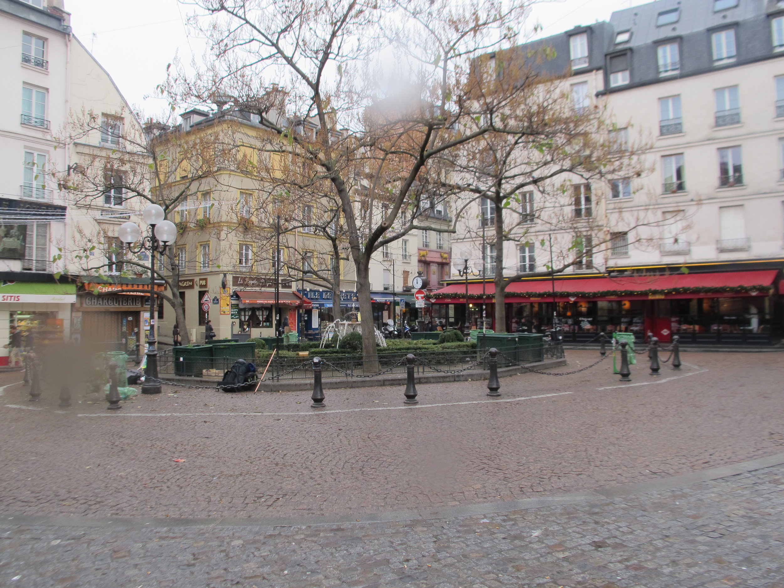 6. La Place de la Contrescarpe, around the corner from Hemingway's first apartment in Paris. He mentions The Cafe des Amateurs, with the red awning, now the Cafe Delmas, in The Sun Also Rises.JPG