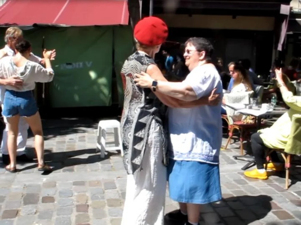 Our guest, Pam (right), dancing with a local at the weekly Bal Musette in the Latin Quarter in Paris. Photo Travellati Tours.