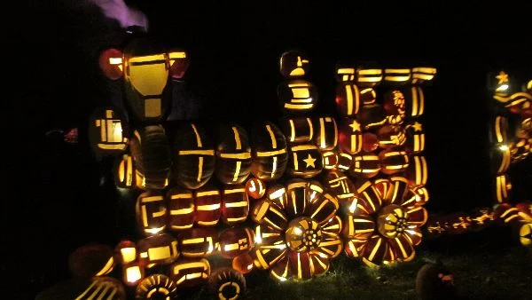 The Circus Train engine puffing purple steam at the Great Jack O'Lantern Blaze at Van Cortlandt Manor. Photo Travellati Tours.