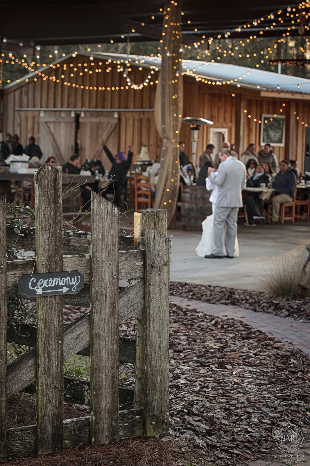 16-rustic-reception-ceremony-lights-first-dance-isola-farms-jarstudio.jpg