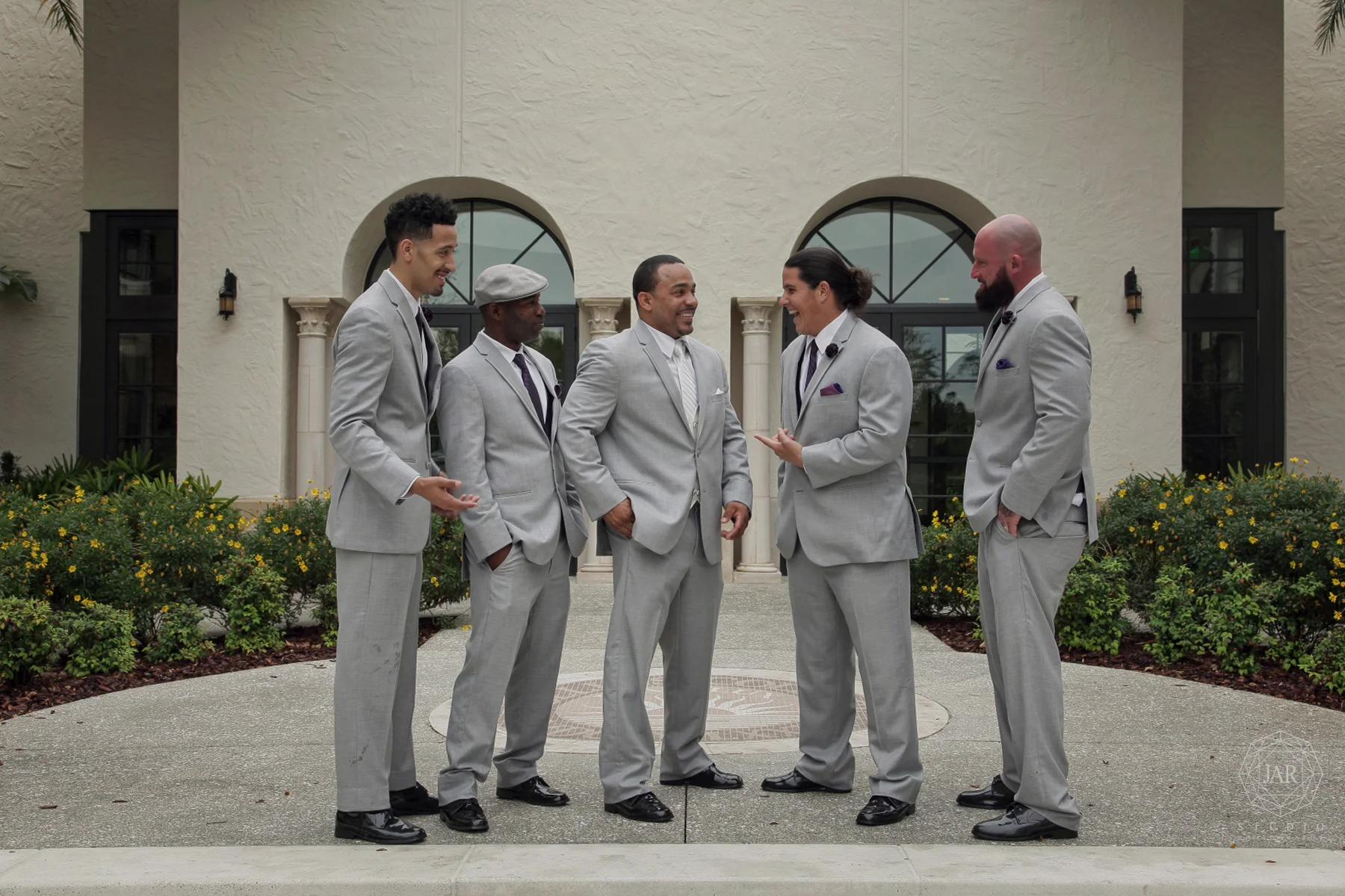 21-groomsmen-gray-tuxedos-purple-courtyard-jarstudio.JPG